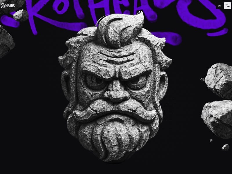Stone sculpture of an intense, stylized face floating against a dark background with bold purple graffiti text, creating a striking and expressive visual.