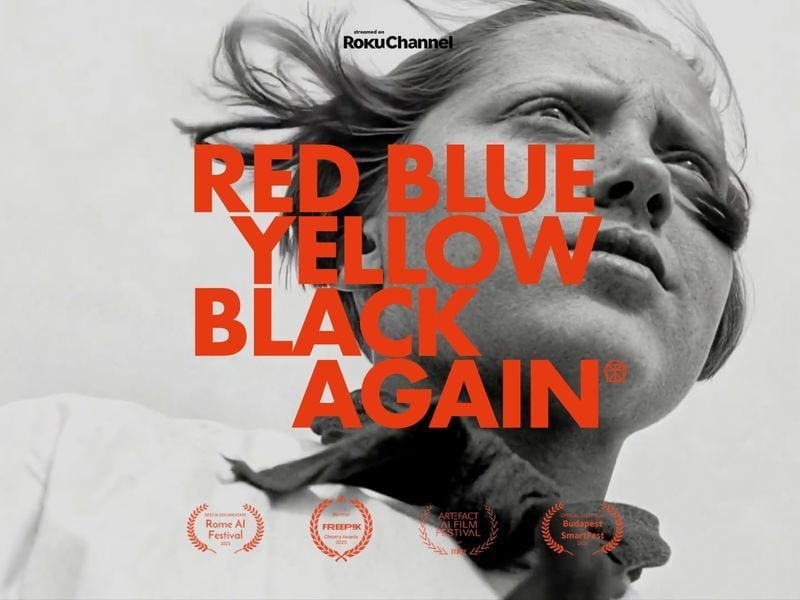 Black and white portrait of a woman with wind-blown hair, overlaid with bold red “Red Blue Yellow Black Again” typography and award laurels